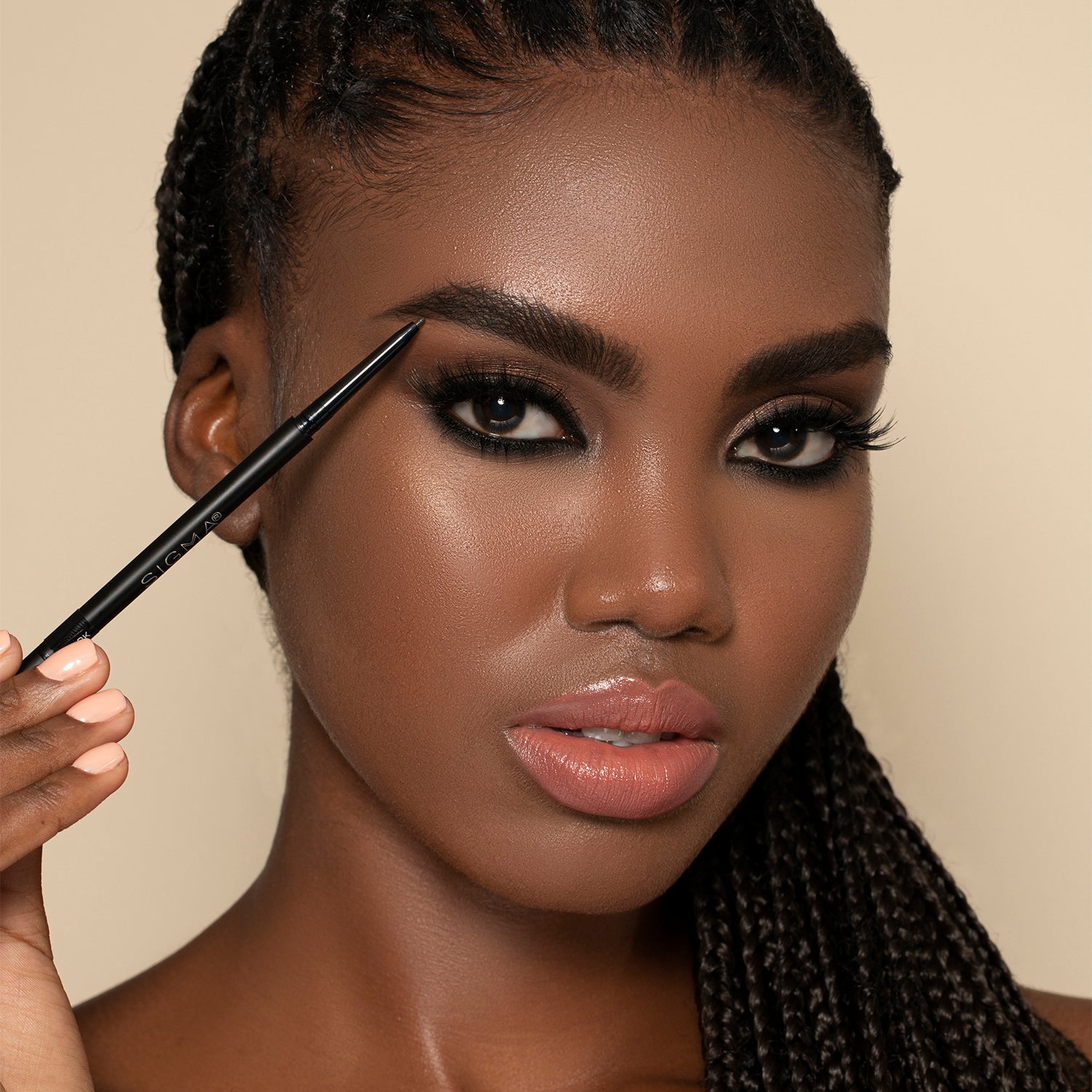 Woman using pencil brush for eyebrows